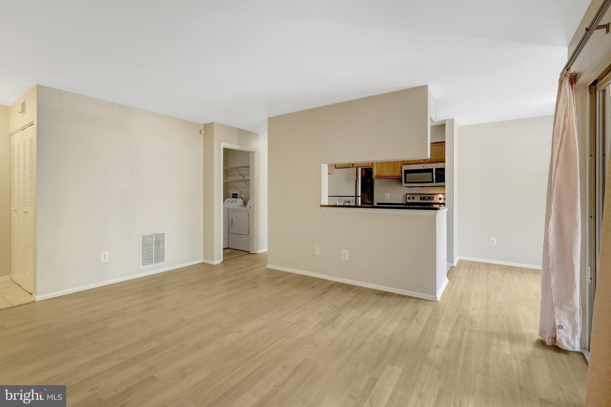 1791 Jonathan Way, Unit 1791B Reston, VA 20190 - Photo 5 of 27 a view of a livingroom with wooden floor
