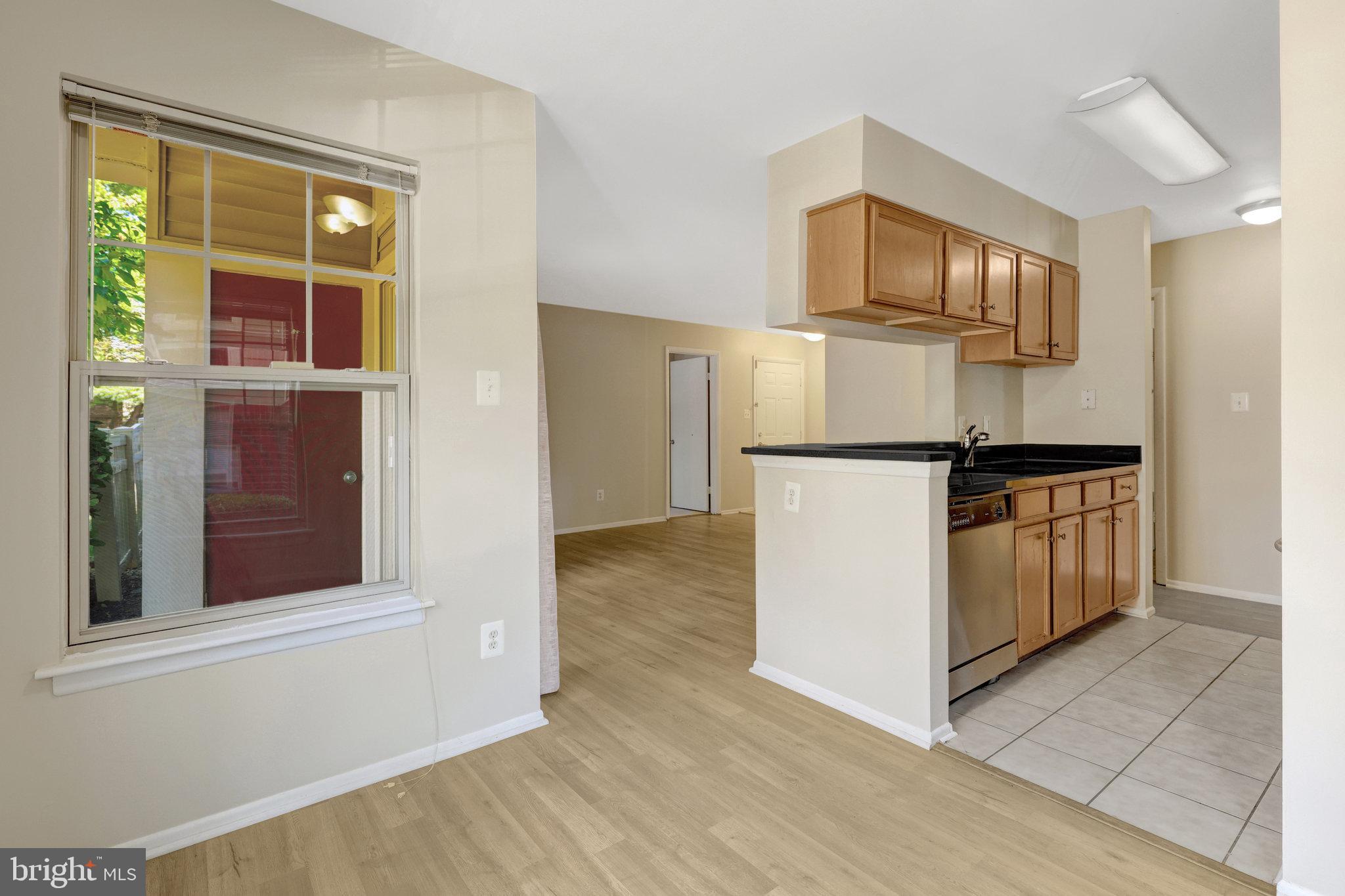 1791 Jonathan Way, Unit 1791B Reston, VA 20190 - Photo 6 of 27 a kitchen with a refrigerator and a stove top oven