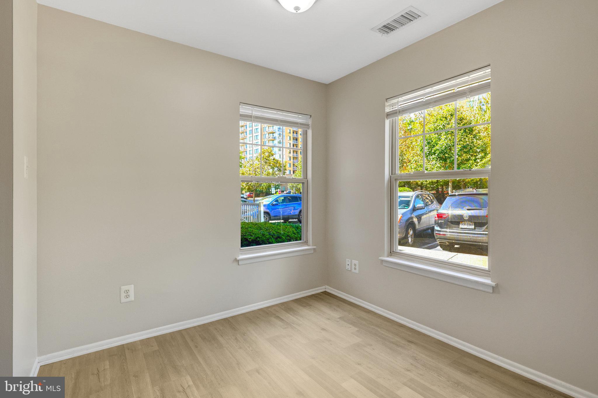 1791 Jonathan Way, Unit 1791B Reston, VA 20190 - Photo 7 of 27 an empty room with windows and closet