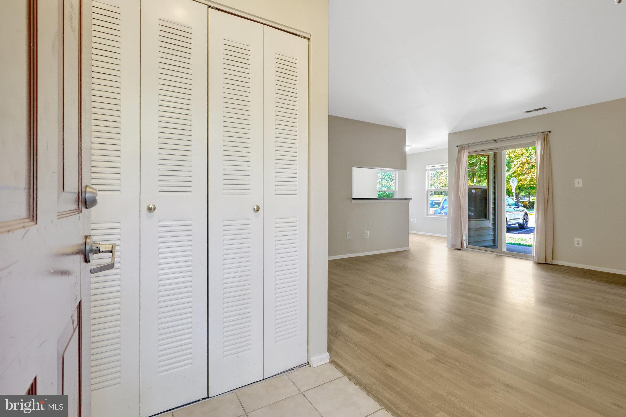 1791 Jonathan Way, Unit 1791B Reston, VA 20190 - Photo 8 of 27 wooden floor in an empty room with a window