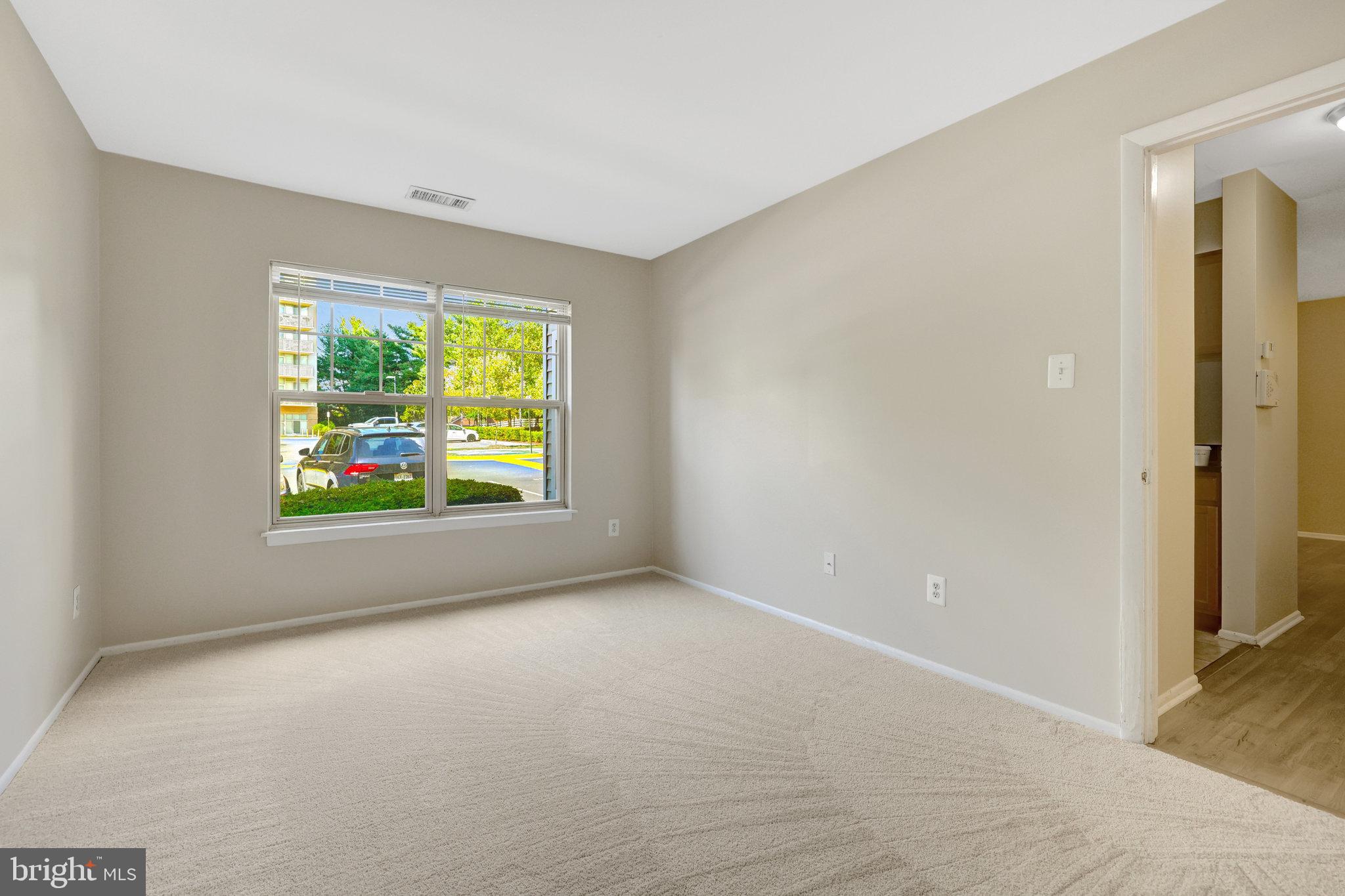 1791 Jonathan Way, Unit 1791B Reston, VA 20190 - Photo 9 of 27 an empty room with windows