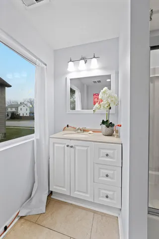 a bathroom with a sink and a mirror