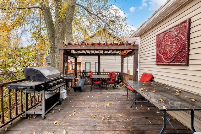 a backyard of a house with table and chairs