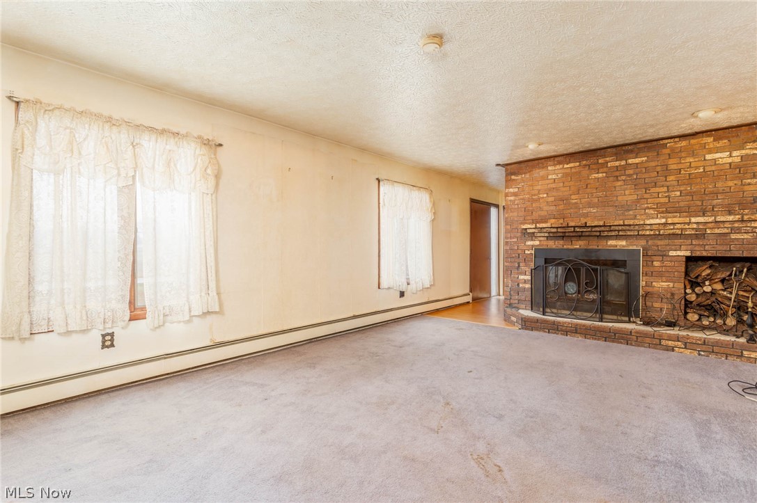 10240 Reed Road Columbia Station, OH 44028 - Photo 3 of 35 Formal living room with custom brick wood burning fireplace