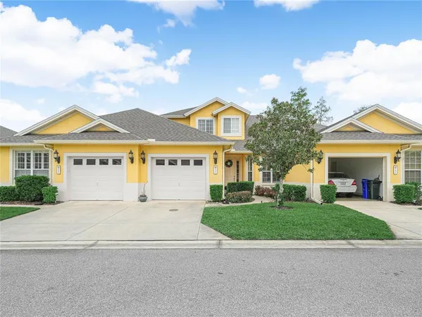 a view of house with a garden and pathway