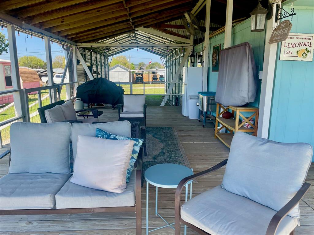 2334 San Bar Road, Unit 96 Graford, TX 76449 - Photo 4 of 40 The covered deck and carport blend together for even more room when the whole gang comes over after a day on the lake!