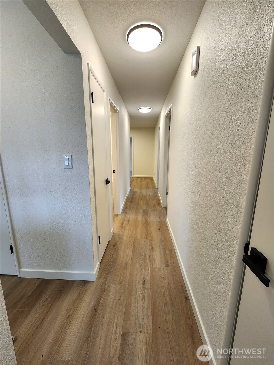 103 Kraft Road Longview, WA 98632 - Photo 15 of 19 a view of a hallway with wooden floor