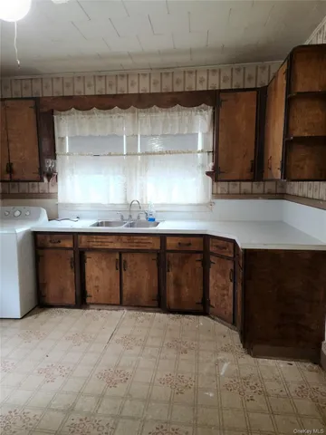 a kitchen with a sink and a cabinets