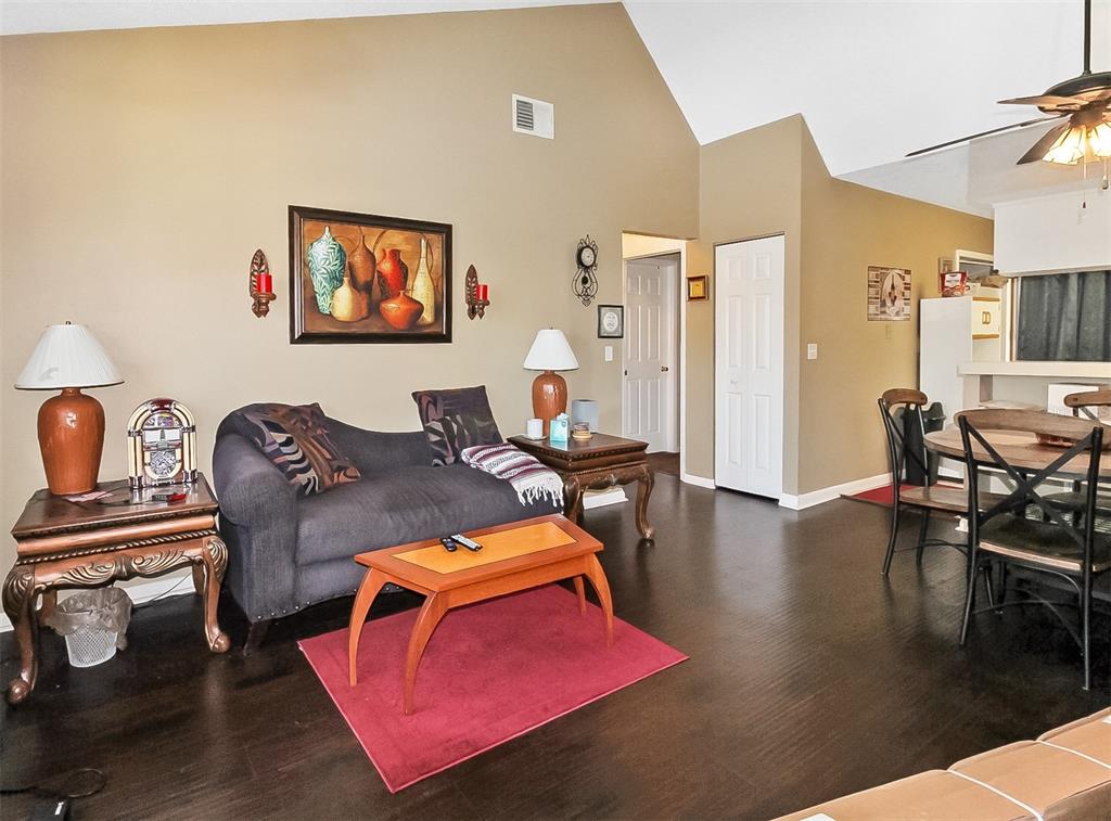 6338 Spring Flower Drive, Unit 21 New Port Richey, FL 34653 - Photo 4 of 18 a living room with furniture and wooden floor