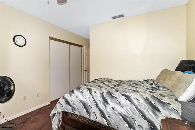 a bedroom with a bed and a table in it