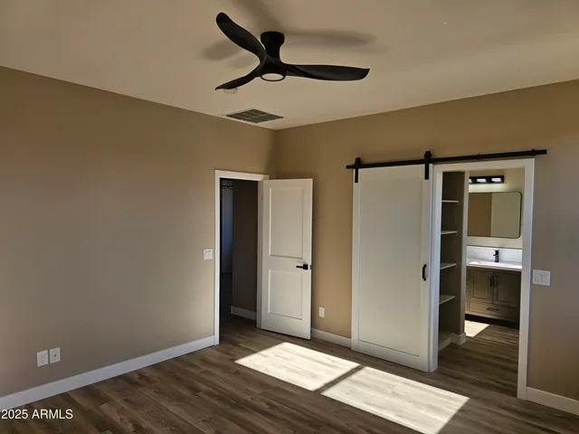 a view of livingroom with hardwood floor and hallway