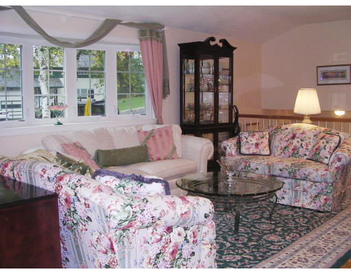 32 Squire Road Winchester, MA 01890 - Photo 2 of 6 a living room with a large bed and a large window