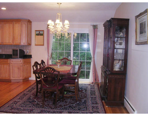 32 Squire Road Winchester, MA 01890 - Photo 3 of 6 a view of a dining room with furniture and chandelier