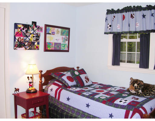 32 Squire Road Winchester, MA 01890 - Photo 6 of 6 a bedroom with a bed and a painting on the wall