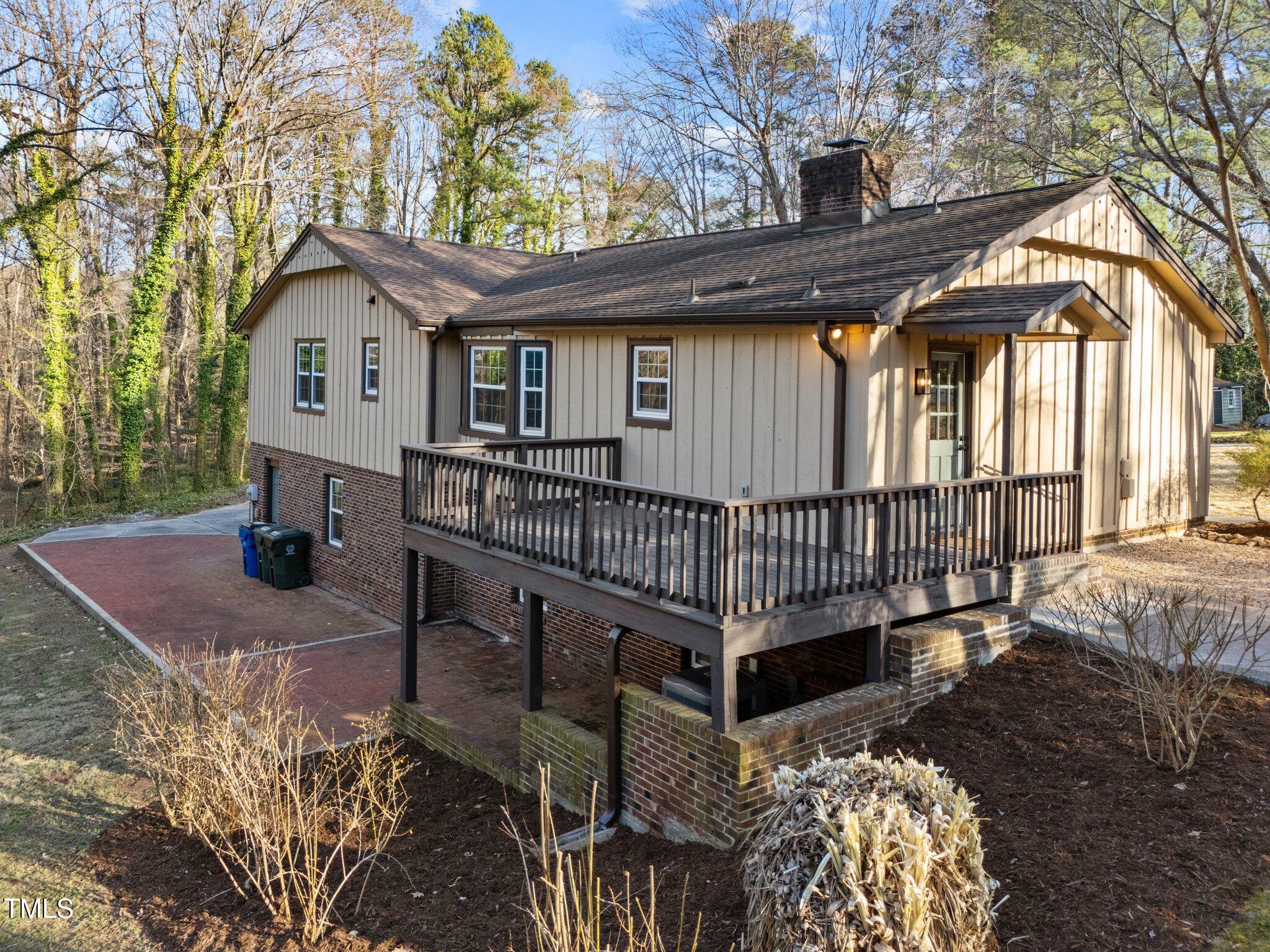 2108 Rangecrest Road Raleigh, NC 27612 - Photo 31 of 38 a view of a house with a wooden deck