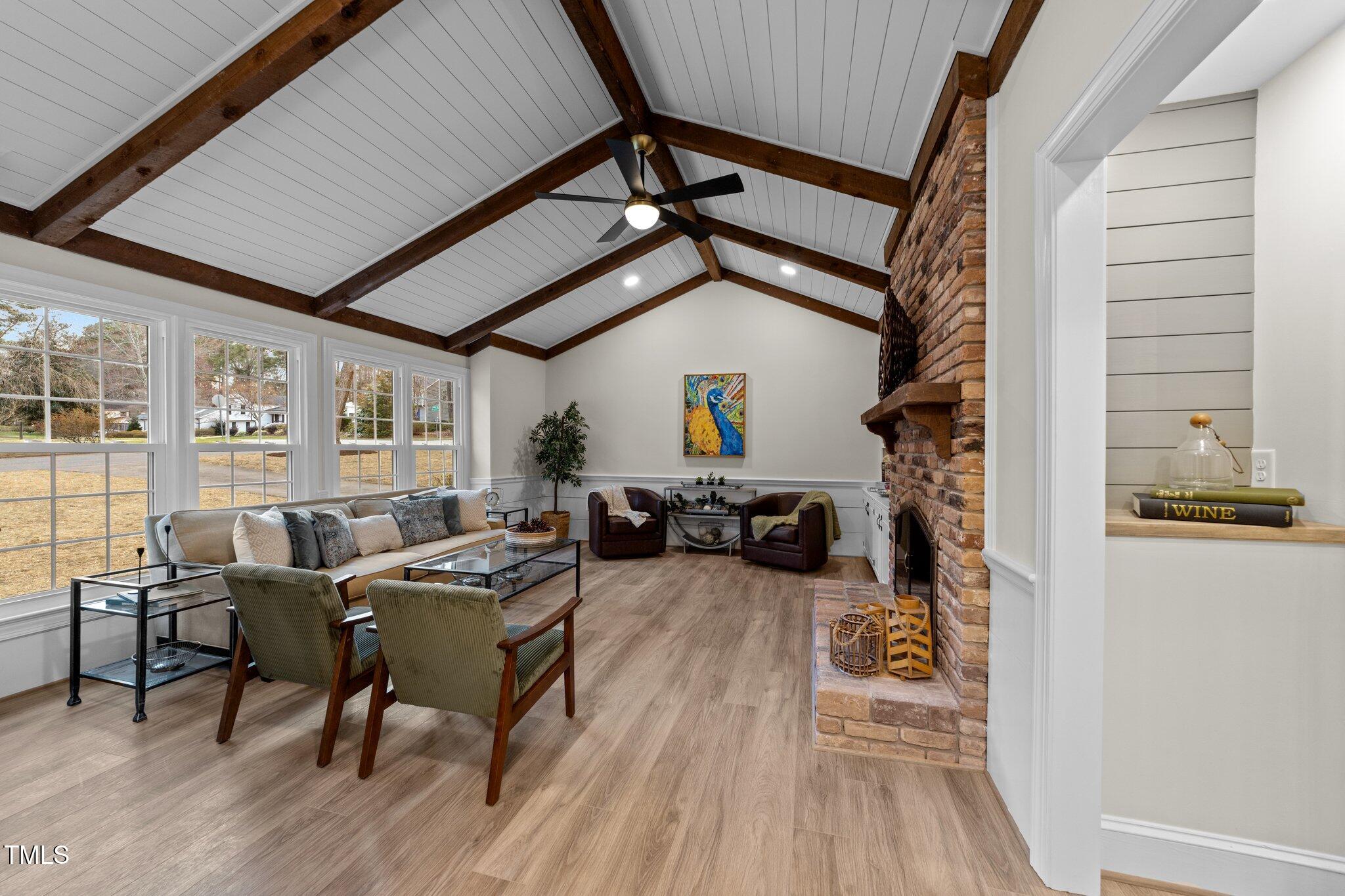 2108 Rangecrest Road Raleigh, NC 27612 - Photo 5 of 38 a view of a livingroom with furniture and a ceiling fan