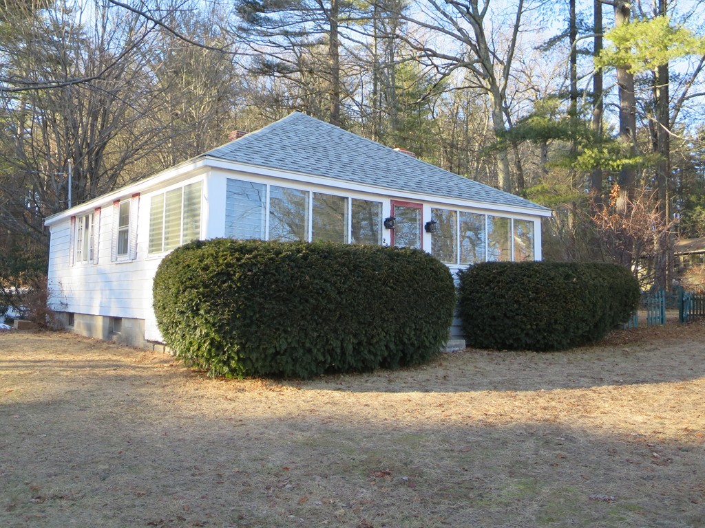 28 Craig Road Holland, MA 01521 - Photo 17 of 19 a front view of a house with a garden