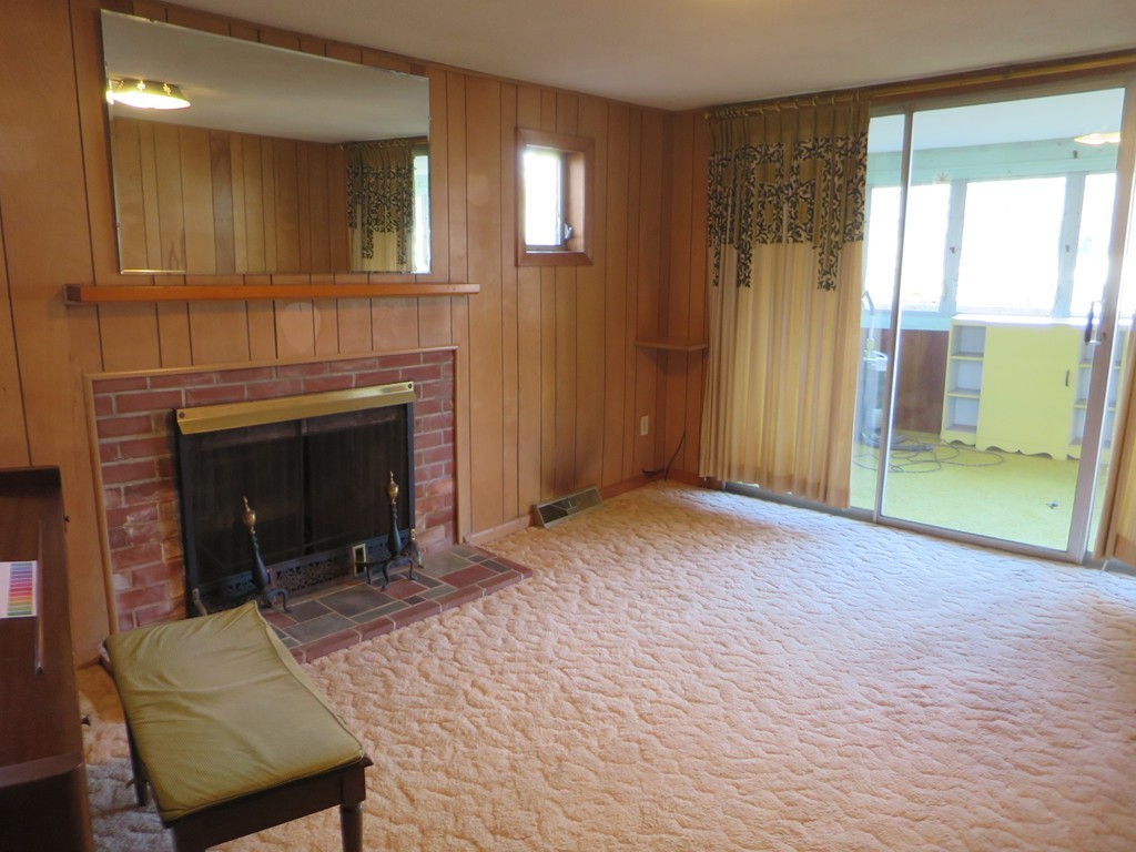 28 Craig Road Holland, MA 01521 - Photo 4 of 19 a living room with furniture and a fireplace