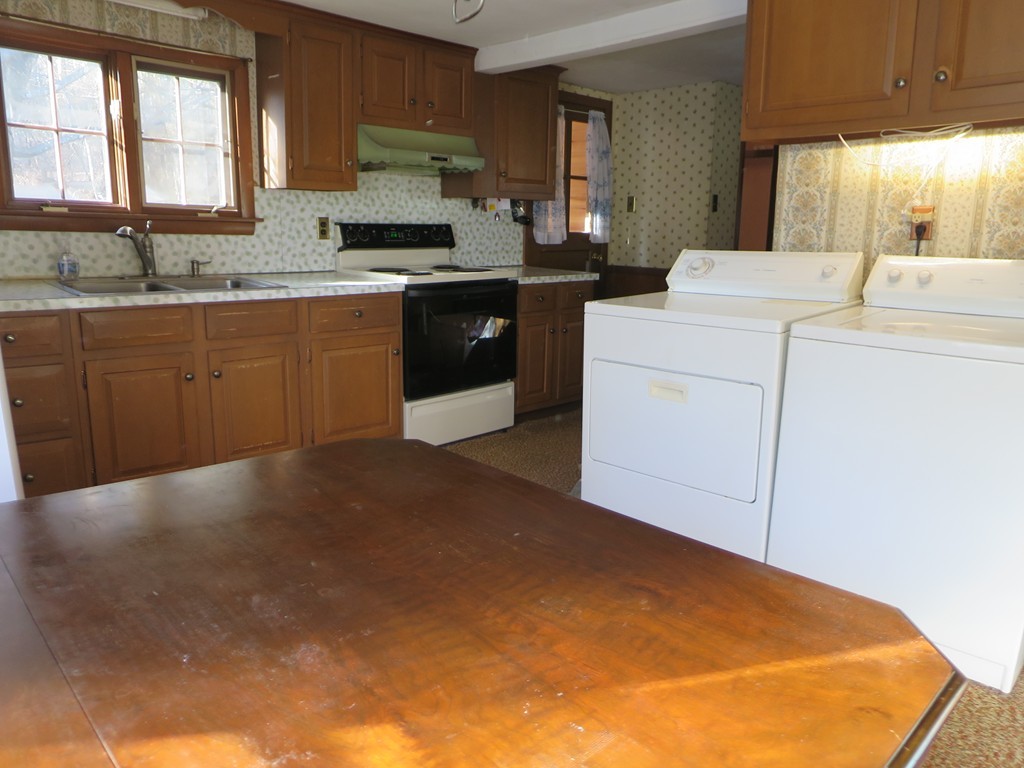 28 Craig Road Holland, MA 01521 - Photo 7 of 19 a kitchen with a sink cabinets and window