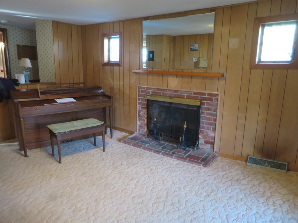 28 Craig Road Holland, MA 01521 - Photo 10 of 19 a living room with furniture and a fireplace
