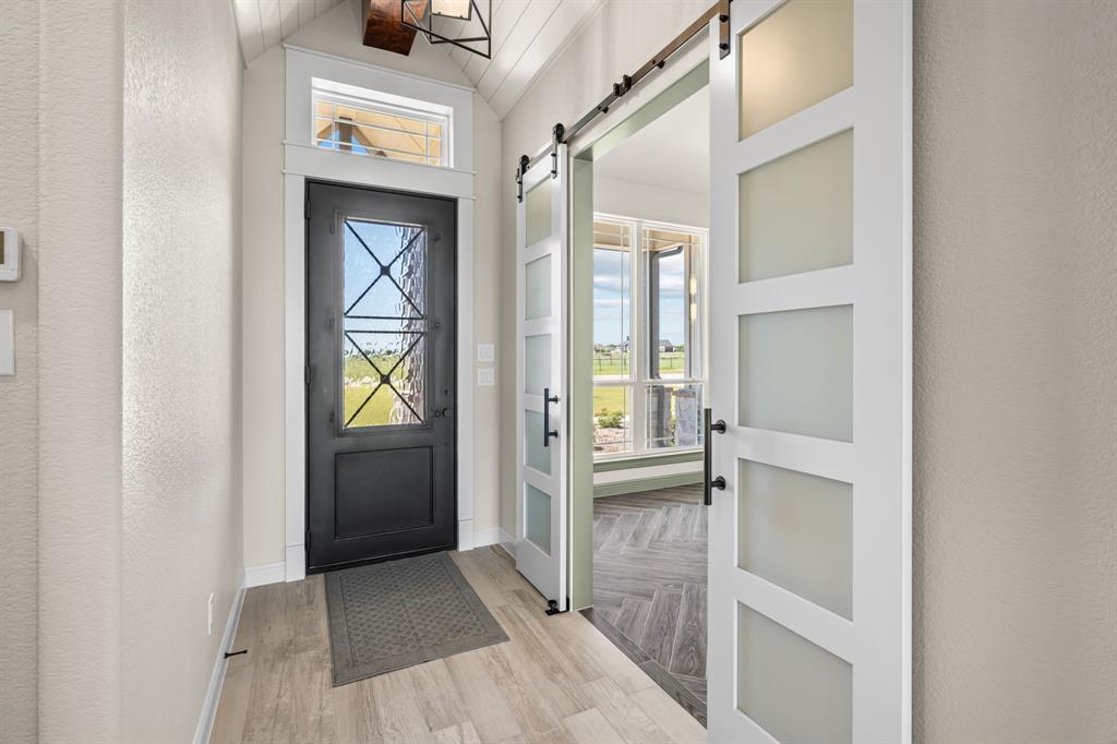 161 Frontera Drive Decatur, TX 76234 - Photo 5 of 39 Front Entry with Iron & Glass Door & Office or Dining Room Doorway