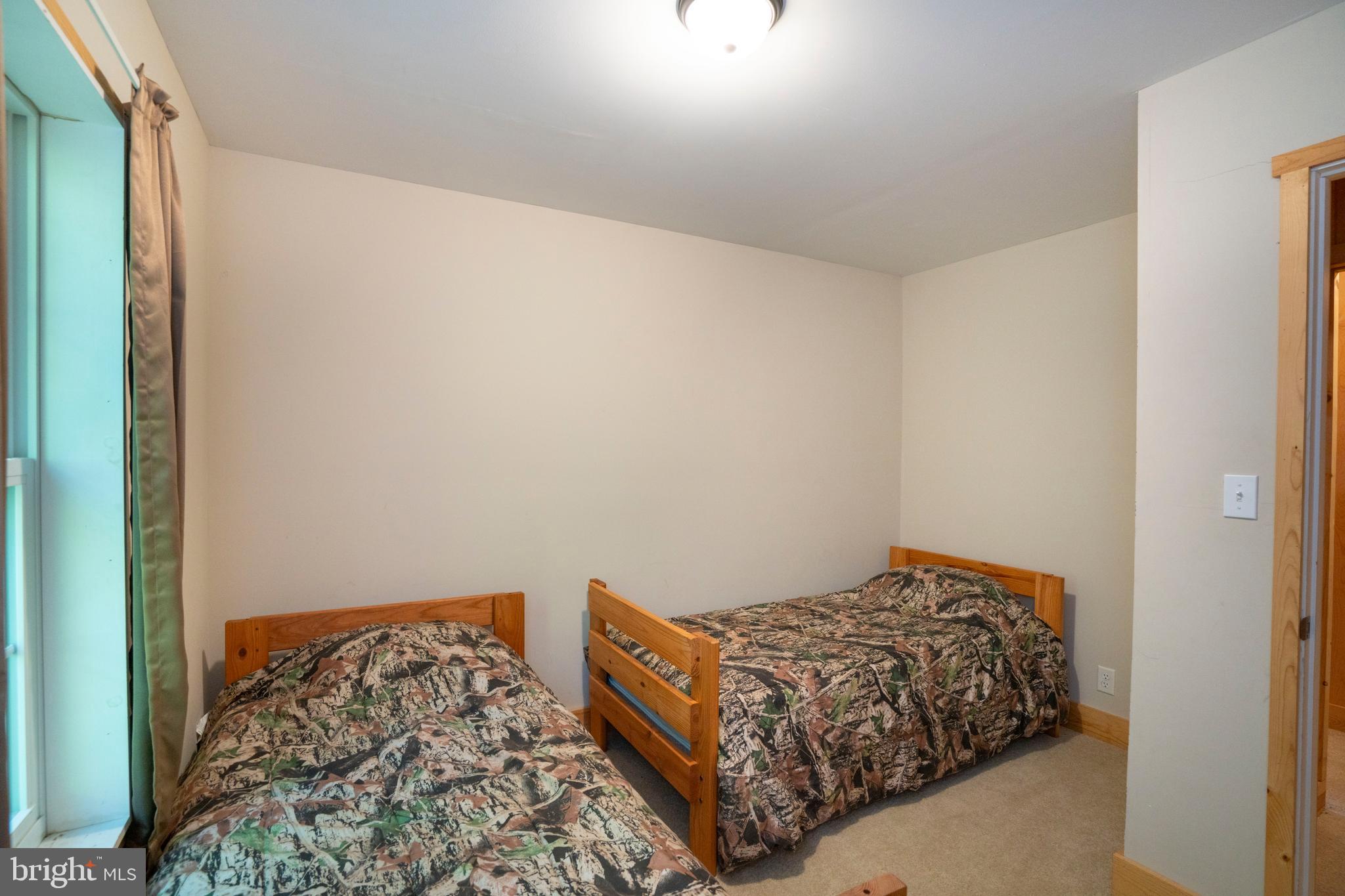 385 Elk Creek Road Aaronsburg, PA 16820 - Photo 46 of 71 a bedroom with a bed and a window