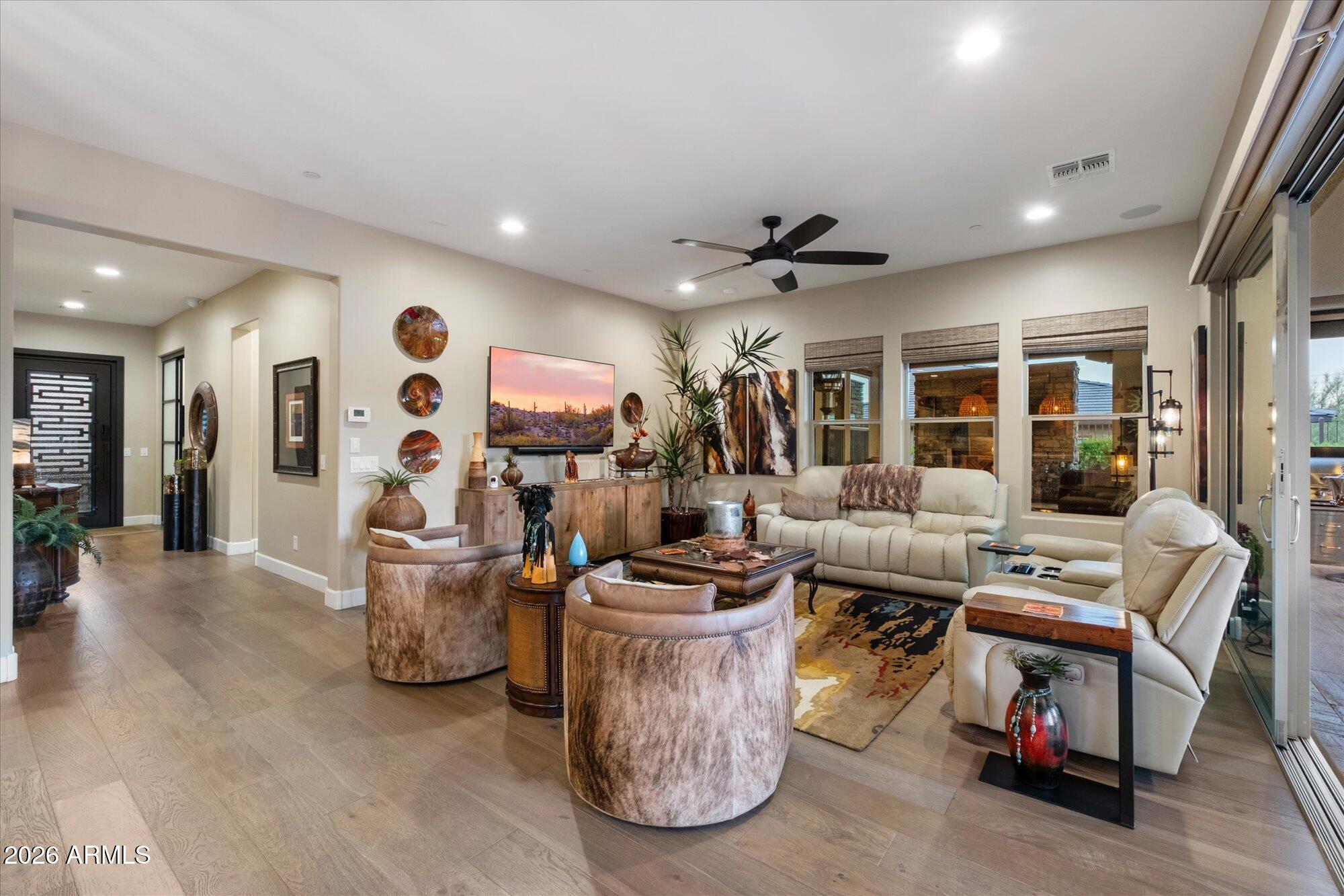 17561 Blaze Lane Rio Verde, AZ 85263 - Photo 11 of 46 a living room with furniture and a flat screen tv