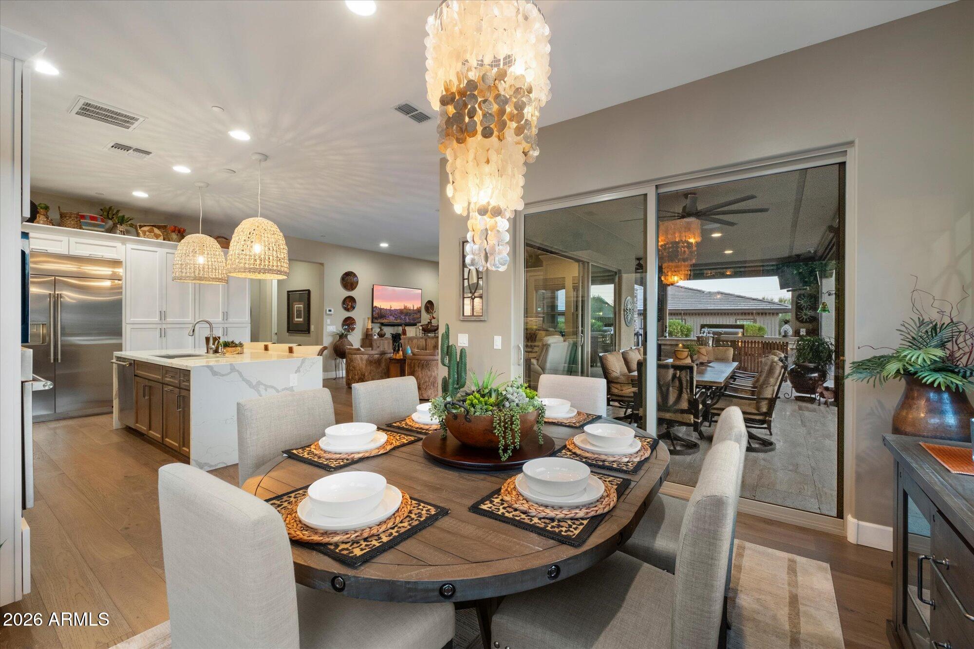 17561 Blaze Lane Rio Verde, AZ 85263 - Photo 13 of 46 a view of a dining room with furniture and chandelier