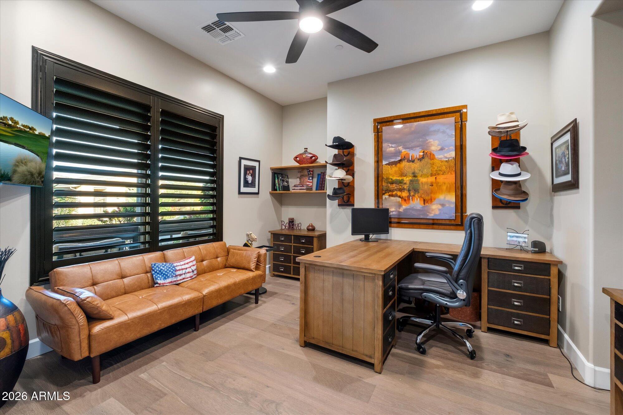 17561 Blaze Lane Rio Verde, AZ 85263 - Photo 18 of 46 a living room with furniture and a flat screen tv