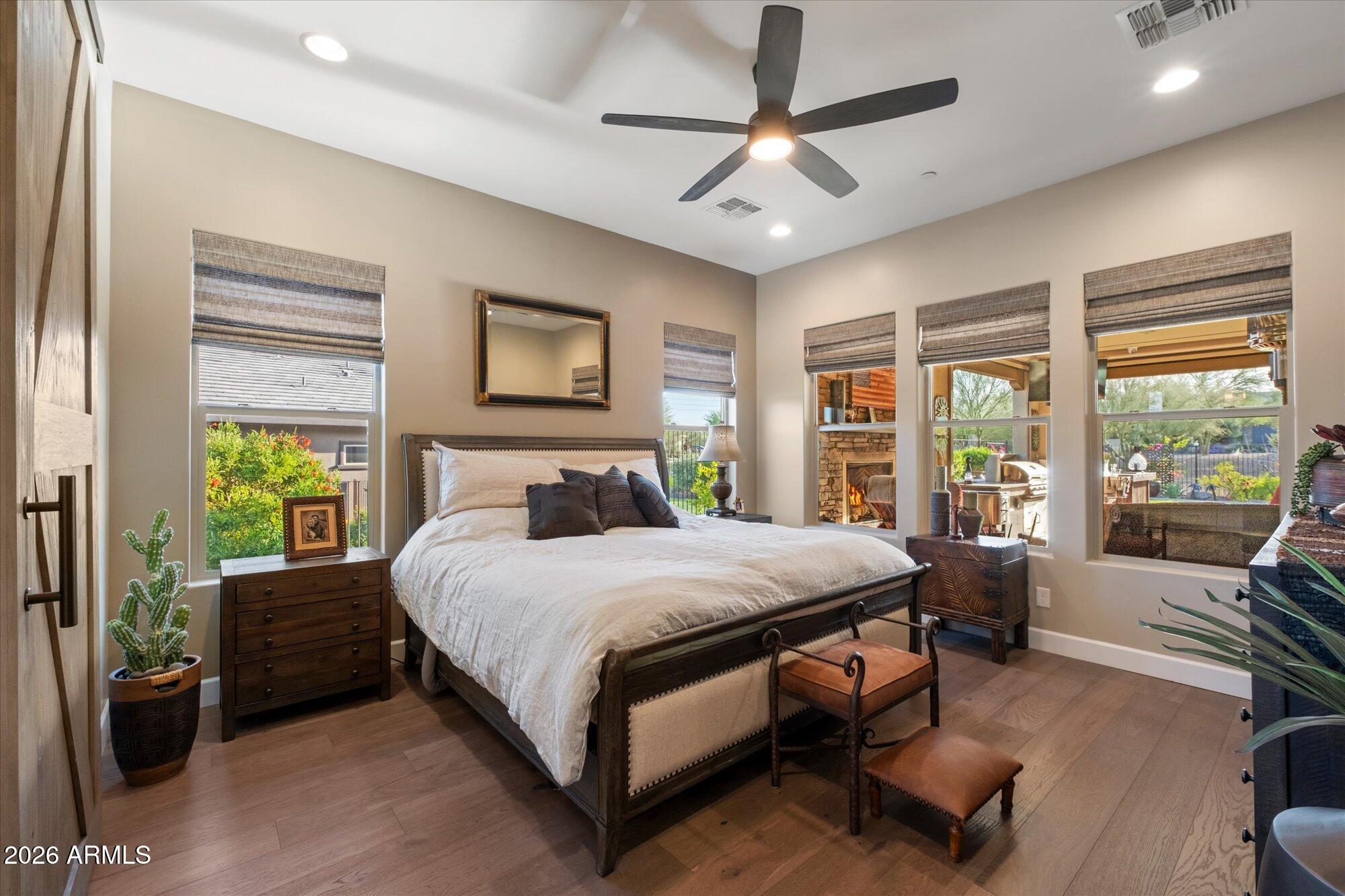 17561 Blaze Lane Rio Verde, AZ 85263 - Photo 20 of 46 a bedroom with a bed a couch and large window