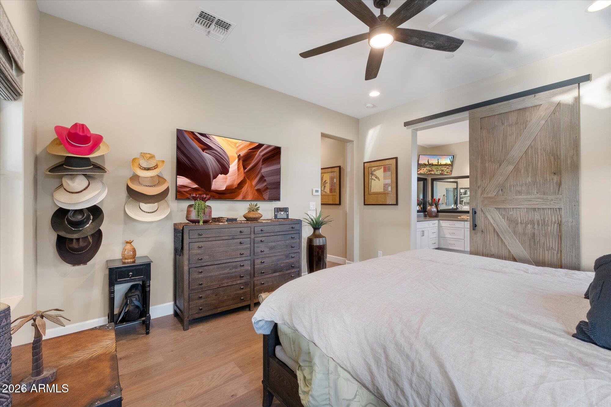 17561 Blaze Lane Rio Verde, AZ 85263 - Photo 21 of 46 a bedroom with a bed and cabinets