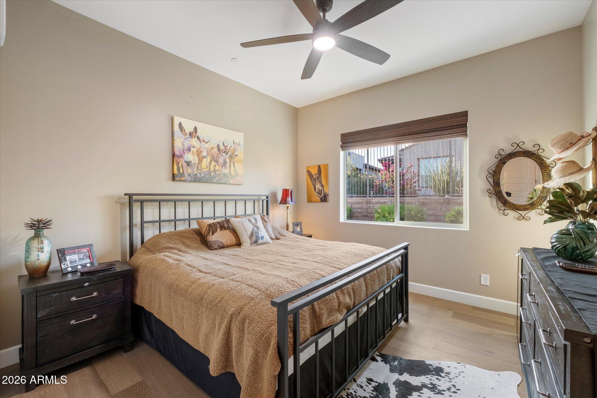 17561 Blaze Lane Rio Verde, AZ 85263 - Photo 25 of 46 a bedroom with a bed and a window