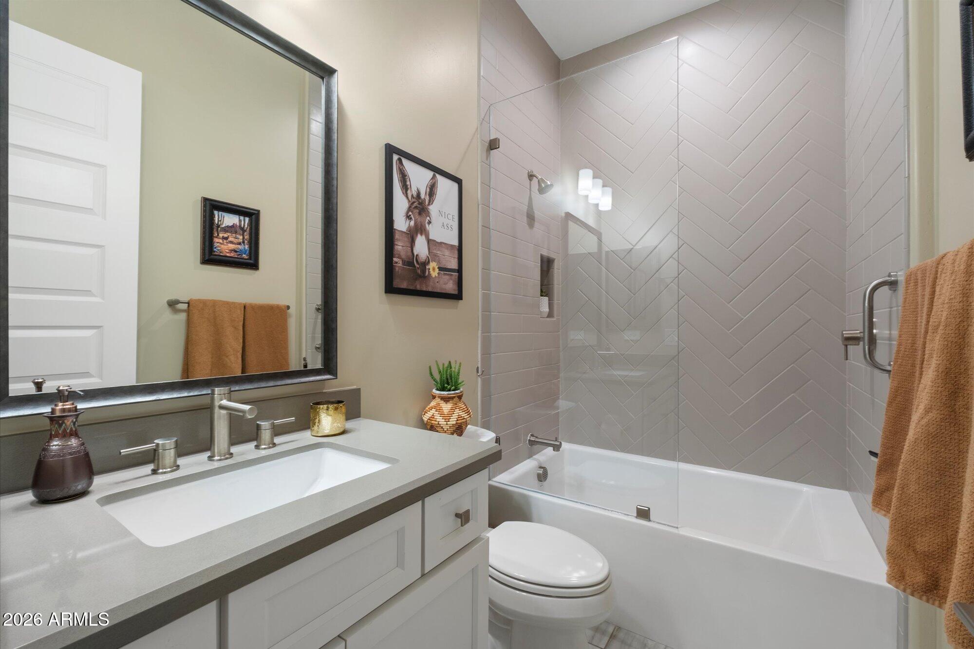 17561 Blaze Lane Rio Verde, AZ 85263 - Photo 26 of 46 a bathroom with a granite countertop sink toilet and shower