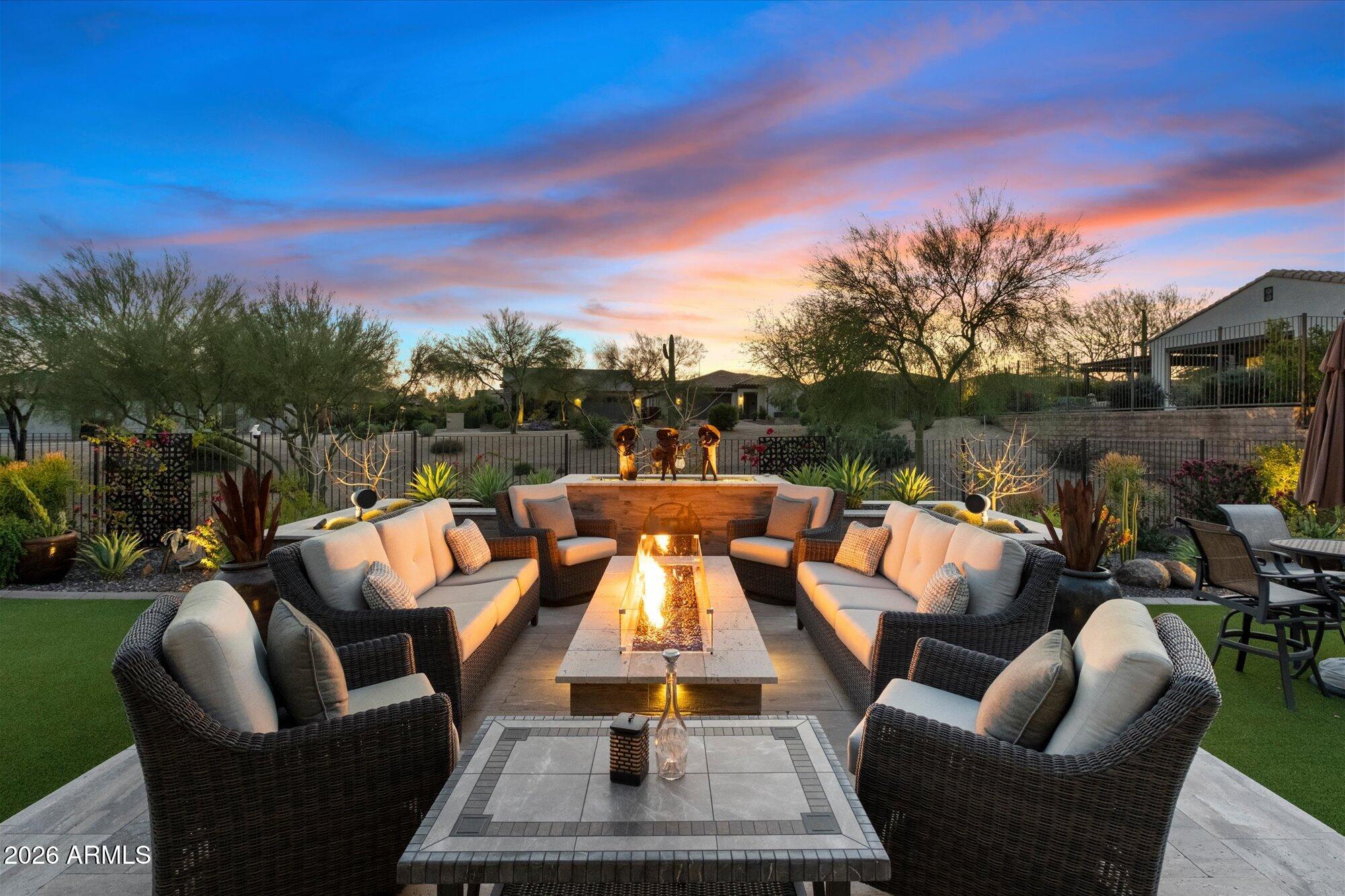 17561 Blaze Lane Rio Verde, AZ 85263 - Photo 34 of 46 a view of a patio with couches chairs and a table