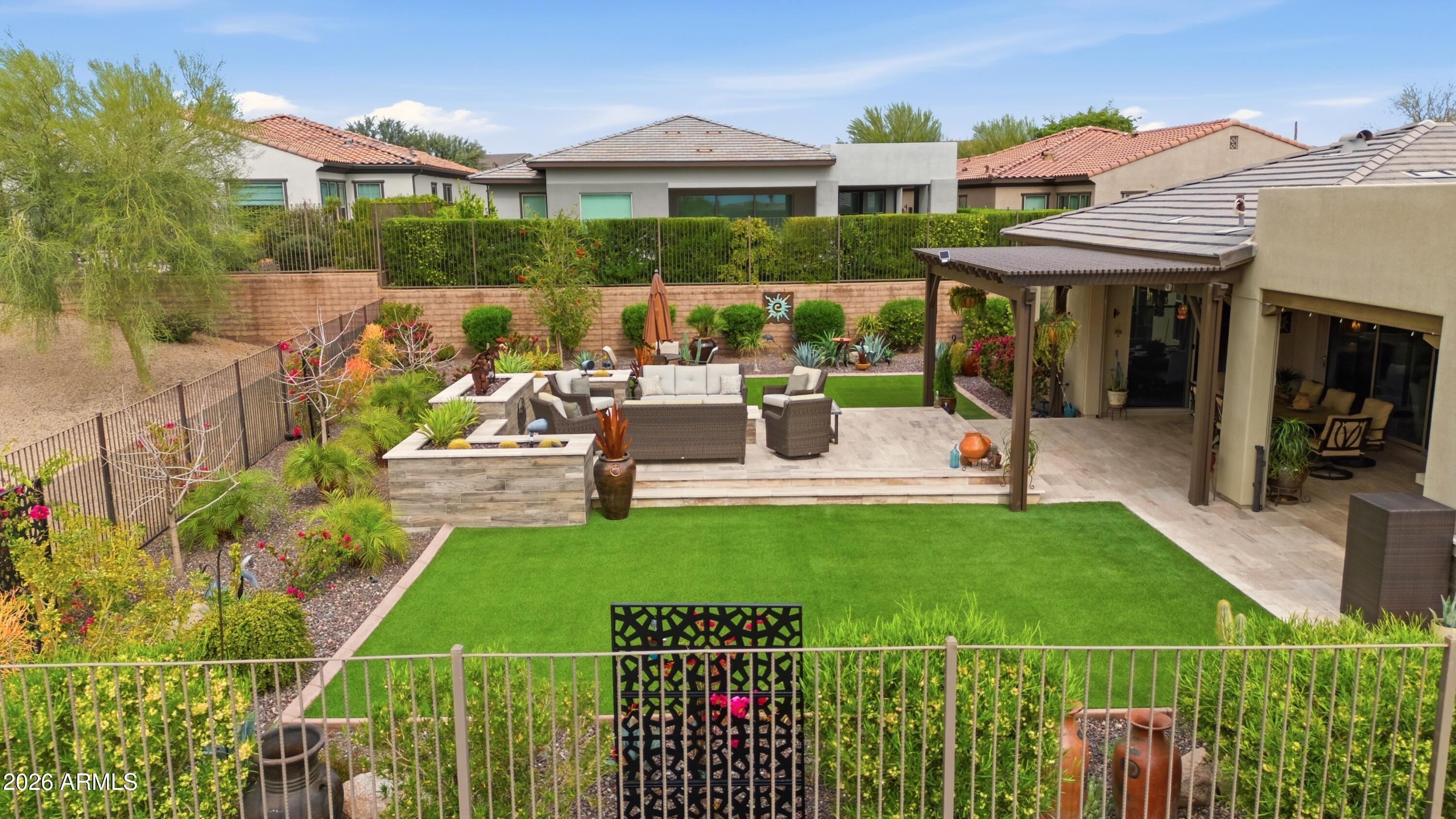 17561 Blaze Lane Rio Verde, AZ 85263 - Photo 38 of 46 a view of a house with backyard sitting area and garden