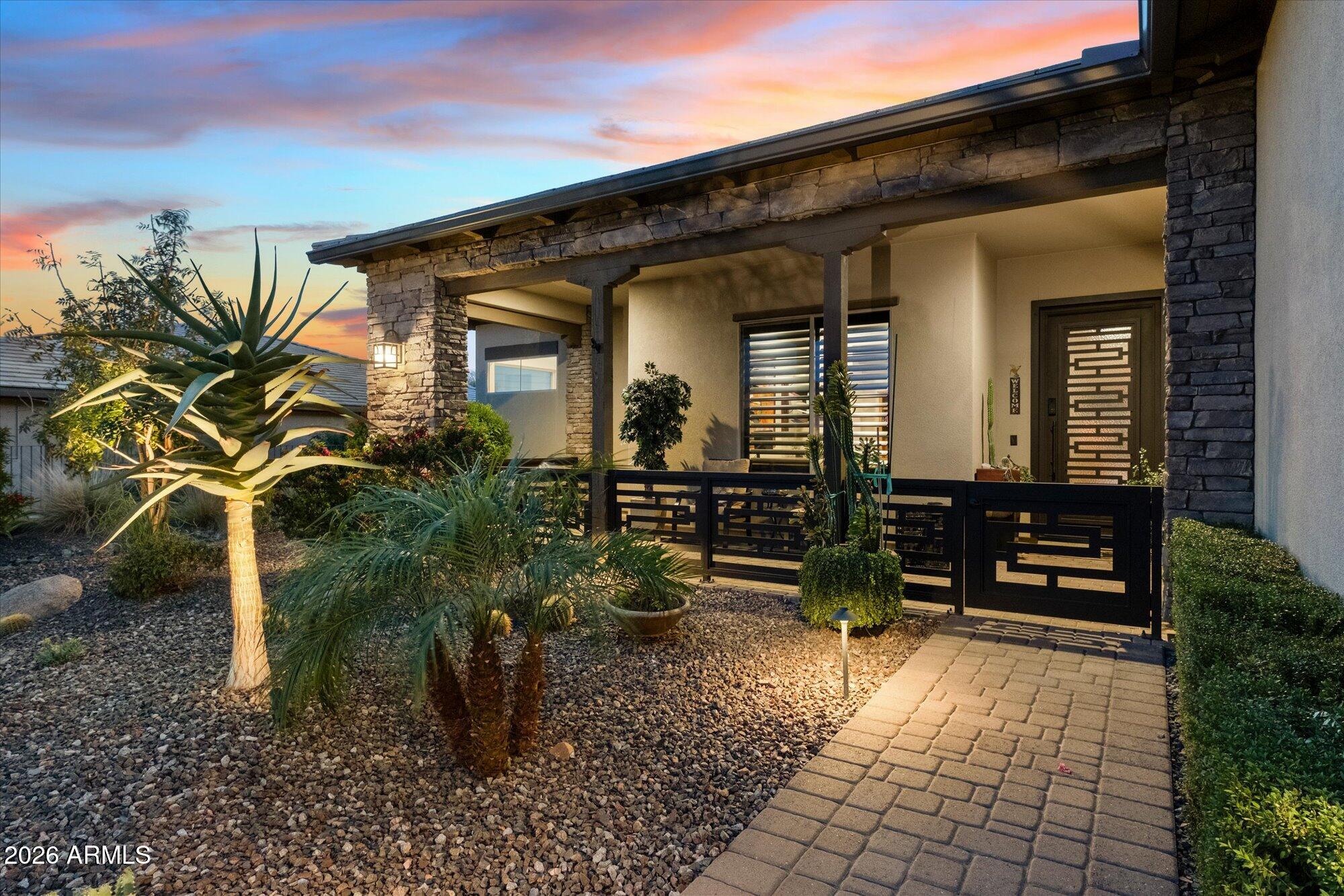 17561 Blaze Lane Rio Verde, AZ 85263 - Photo 4 of 46 a front view of a house with a garden