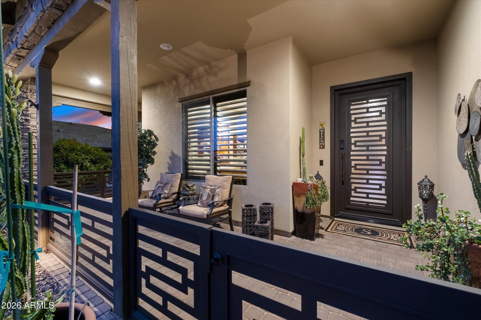 17561 Blaze Lane Rio Verde, AZ 85263 - Photo 6 of 46 a room with lots of potted plants wooden floor and a potted plant