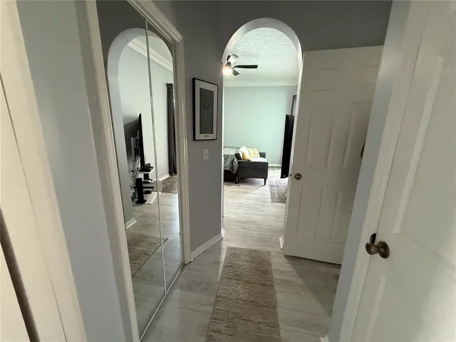 a view of a bathroom from a hallway