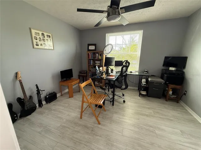 a workspace with furniture hardwood and a window