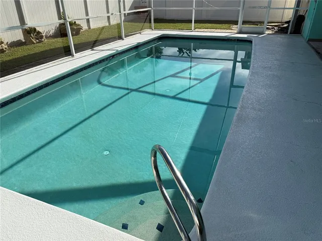 a view of a backyard with chairs