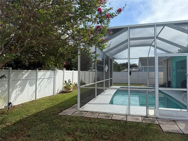 a view of backyard with small cabin