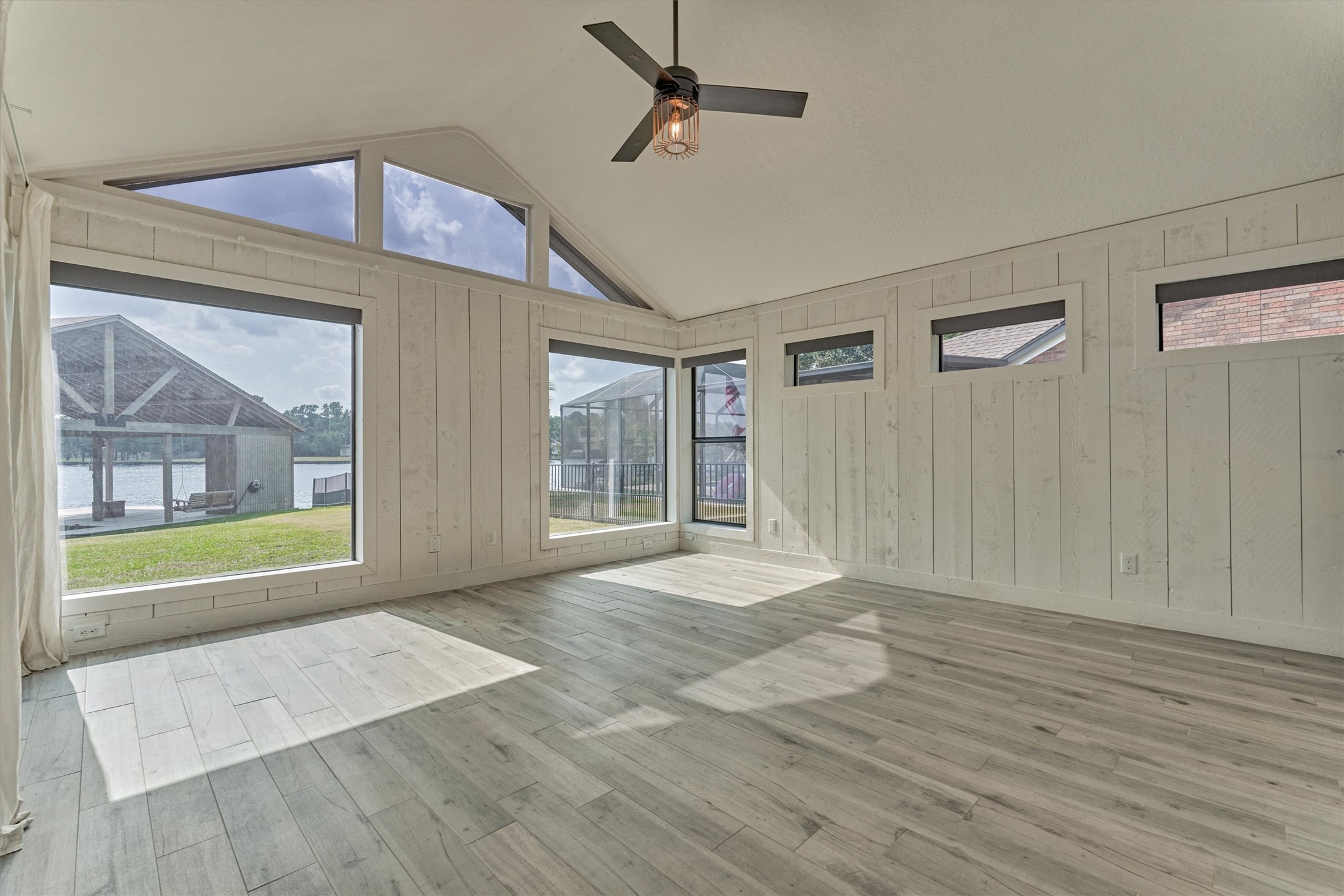 14696 South Diamondhead Conroe, TX 77356 - Photo 19 of 50 Primary bedroom with huge windows and views of the lake/boathouse.