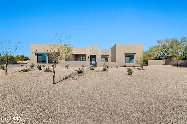 a view of a terrace with chairs and potted plants