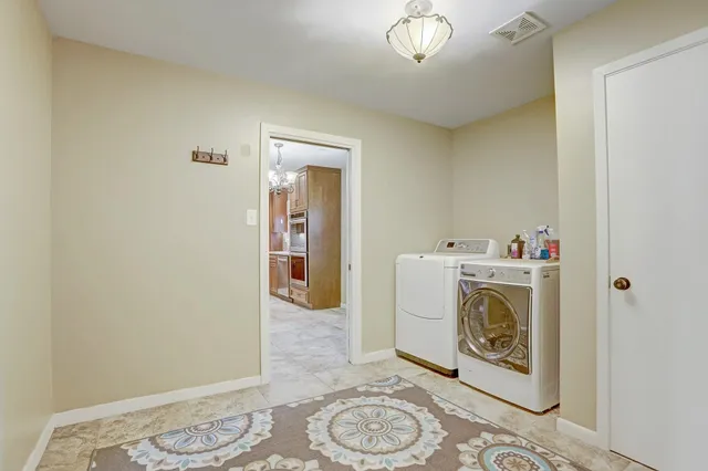 a utility room with dryer and washer