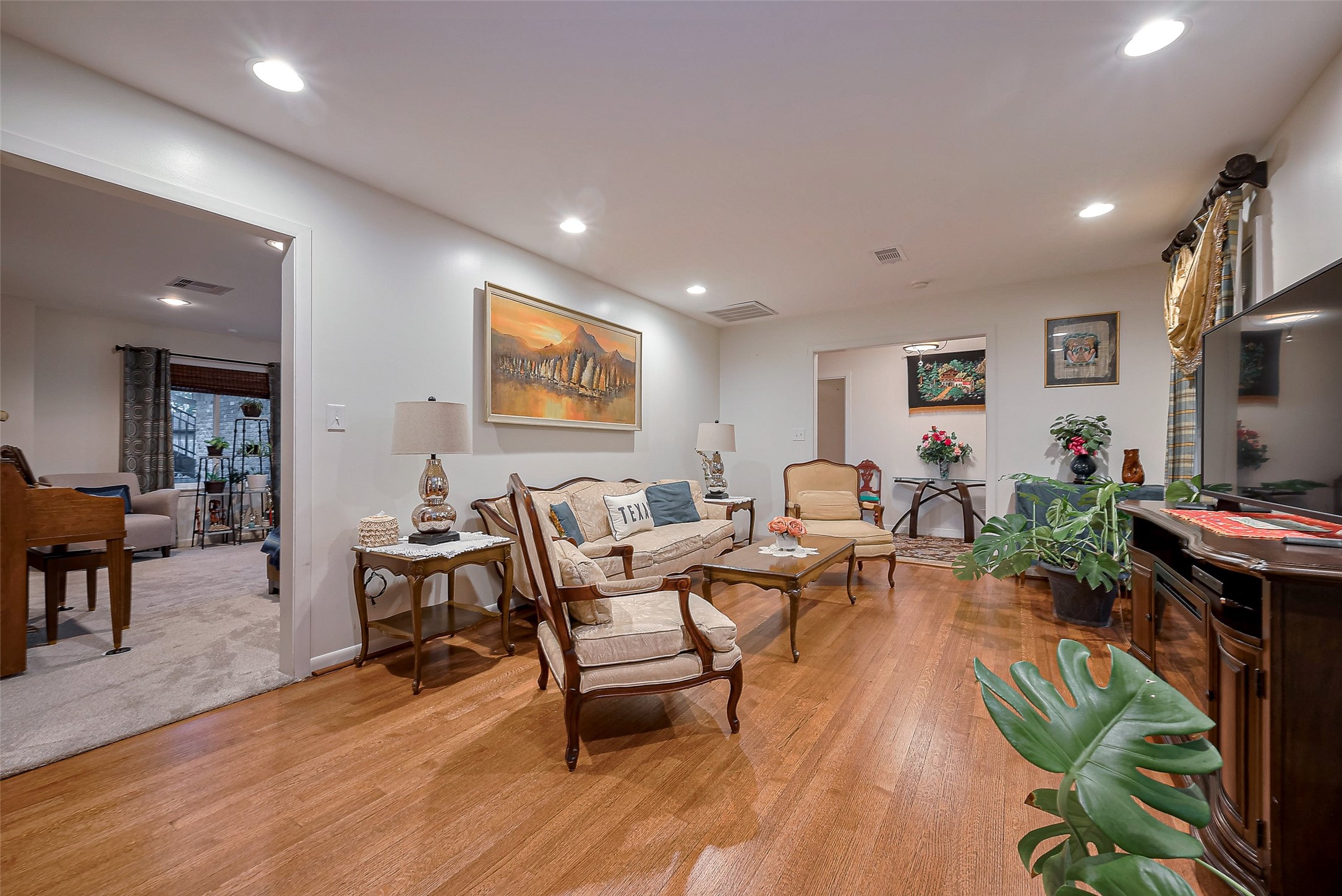 8019 Colgate Street Houston, TX 77061 - Photo 7 of 27 a living room with furniture a flat screen tv and a potted plant