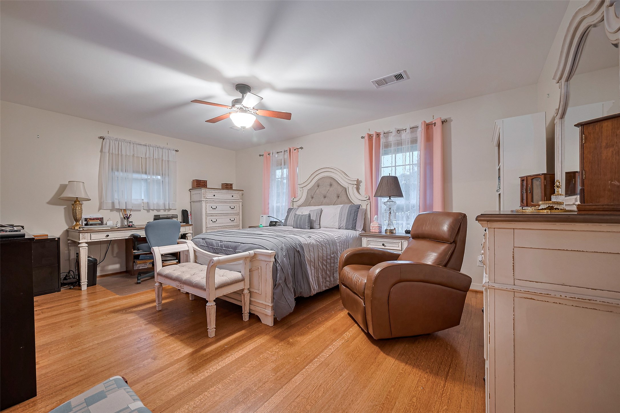 8019 Colgate Street Houston, TX 77061 - Photo 9 of 27 a bed room with furniture and wooden floor