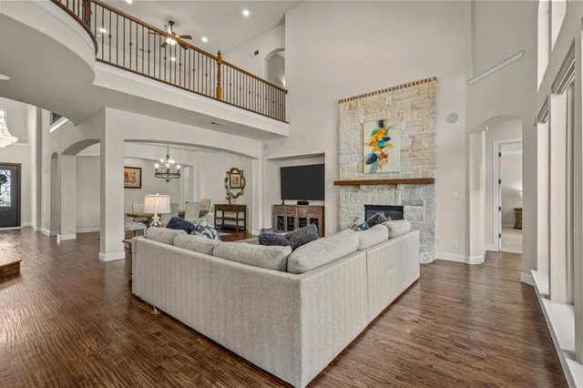 a living room with fireplace furniture and a flat screen tv
