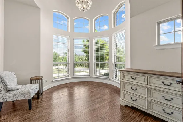 a view of a livingroom with furniture and windows
