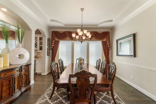 a view of a dining room with furniture and window