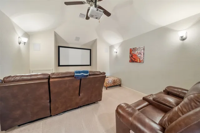 a bathroom with a granite countertop sink vanity and mirror